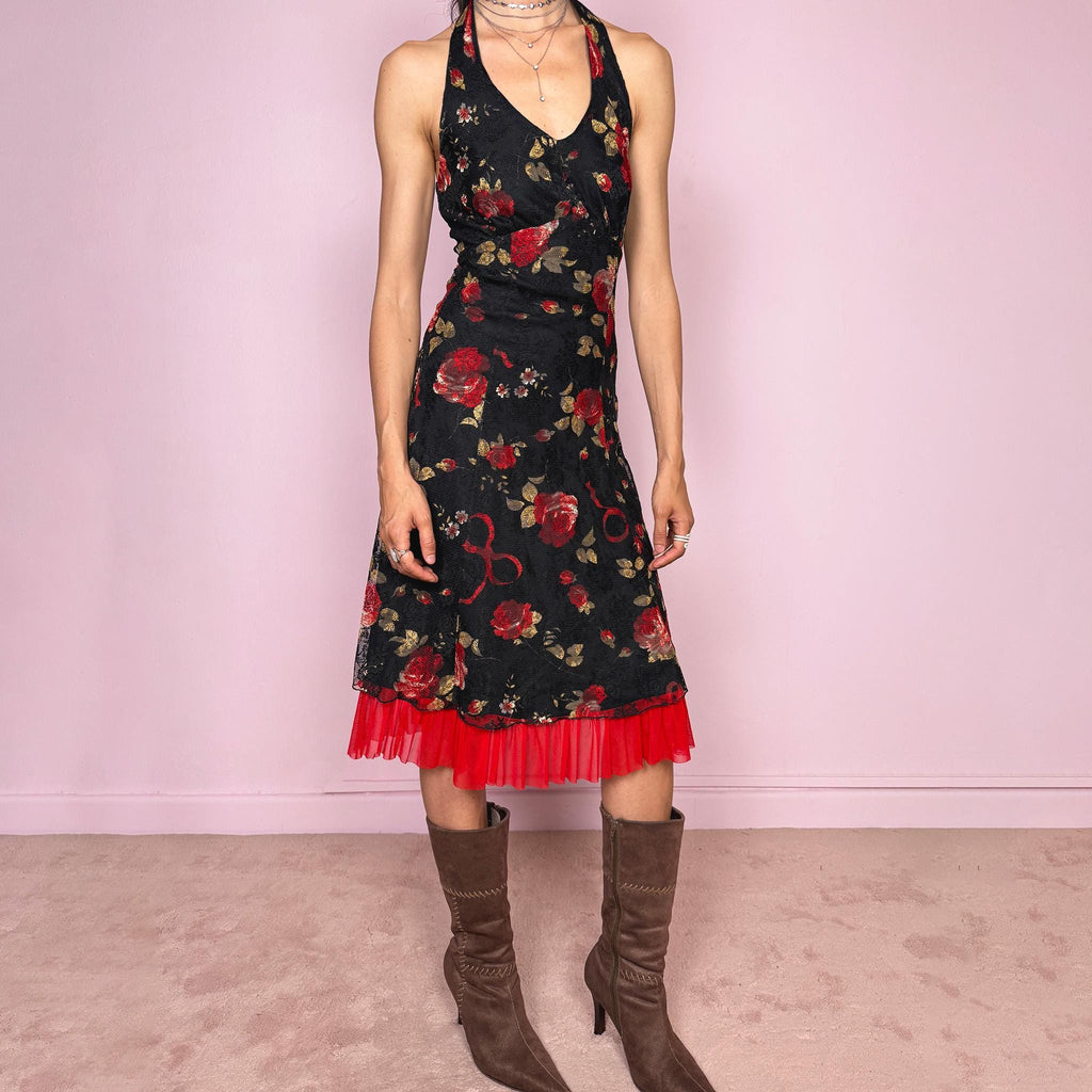 Vintage 2000s black halter tie-neck midi dress with a stretchy fit, V-neckline, backless cut, and side zip closure. Features black lining, a lace mesh overlay with rose print, and a dreamy red ruffle mesh hem. Romantic, feminine, and elegant for summer. Excellent vintage condition.