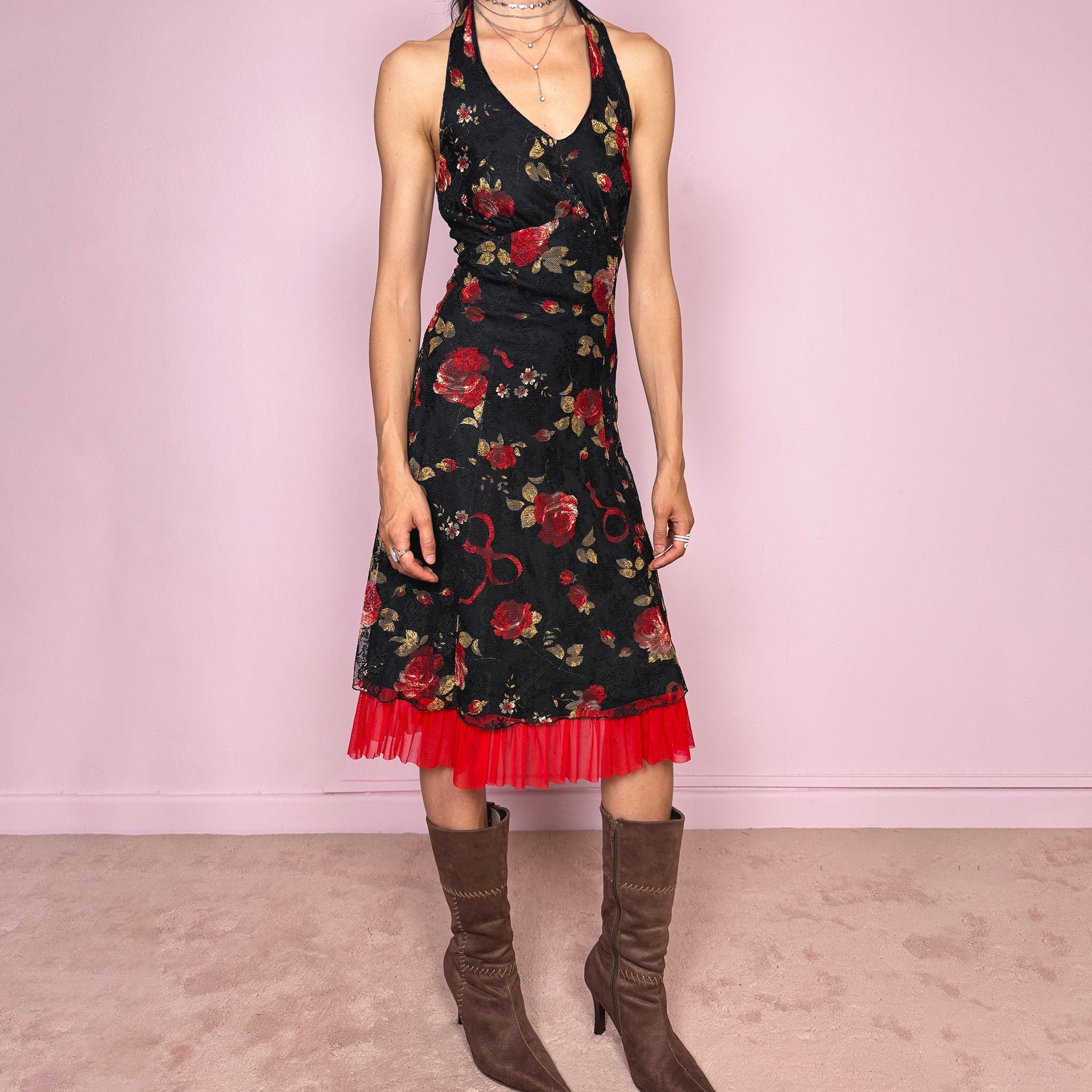 Vintage 2000s black halter tie-neck midi dress with a stretchy fit, V-neckline, backless cut, and side zip closure. Features black lining, a lace mesh overlay with rose print, and a dreamy red ruffle mesh hem. Romantic, feminine, and elegant for summer. Excellent vintage condition.