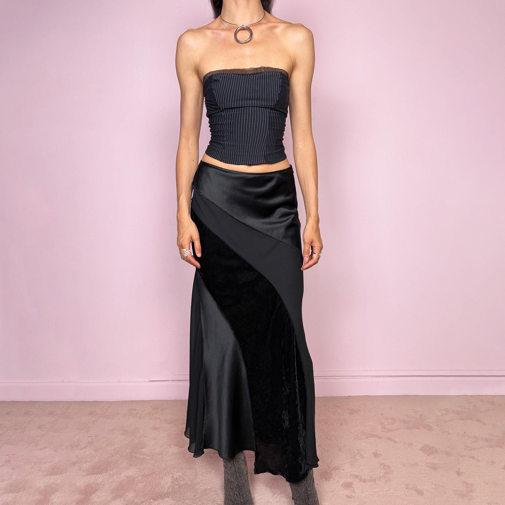 Vintage 2000s black midi skirt with a formal avant-garde minimal look, mixed velvet, satin, and sheer flare panels, asymmetric diagonal construction, side zip closure, and structured no-stretch fit. Elegant statement piece for evening, night, or event styling. Can be worn high waisted for S or lower rise for XS/XXS. Made from polyester. Excellent vintage condition.
