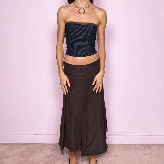 Vintage 2000s elegant brown midi skirt with flared asymmetric silhouette and delicate tulle hem. Features side zip closure, structured no-stretch fabric, and avant-garde deconstructed finish. Can be worn mid to low rise for size S or high waisted for size M. Ideal for gala nights, formal events, or fairycore styling. From a French brand. Excellent vintage condition.