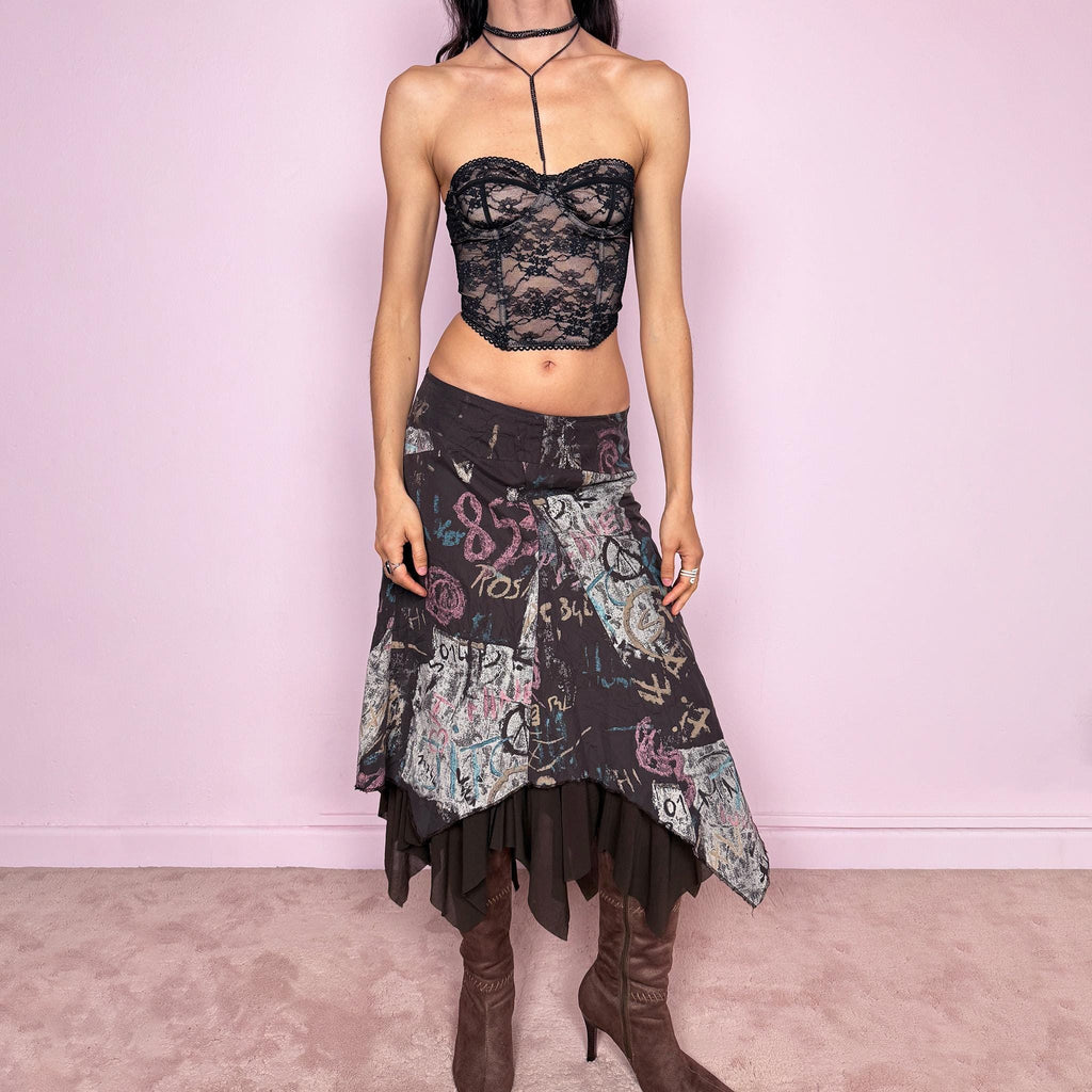 Vintage 2000s brown deconstructed avant garde skirt with a layered asymmetric hem and sheer mesh underlayer. Features a fluid draped silhouette with graphic print and side zip closure, no stretch. Can be worn high rise for size M or mid to low rise for XS/S. Made in France by a French brand from polyamide. Excellent vintage condition.