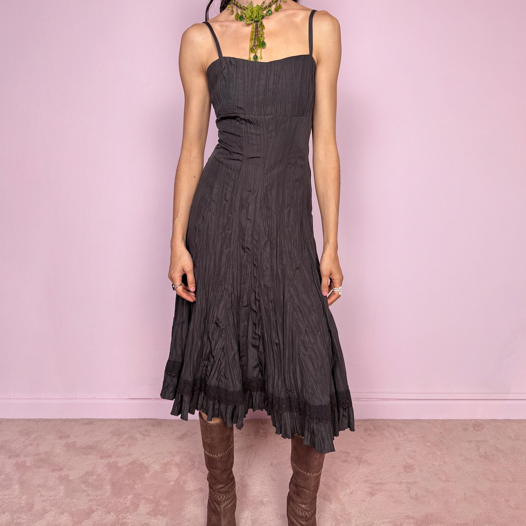 Vintage 2000s dark brown midi dress with a crinkle pleated texture and sleek fitted silhouette. Features adjustable straps, side zip closure, and a soft ruffle hem for fluid movement. Non-stretch design with minimal avant-garde elegance, perfect for formal parties, night events, or dark fairy styling. Excellent vintage condition.
