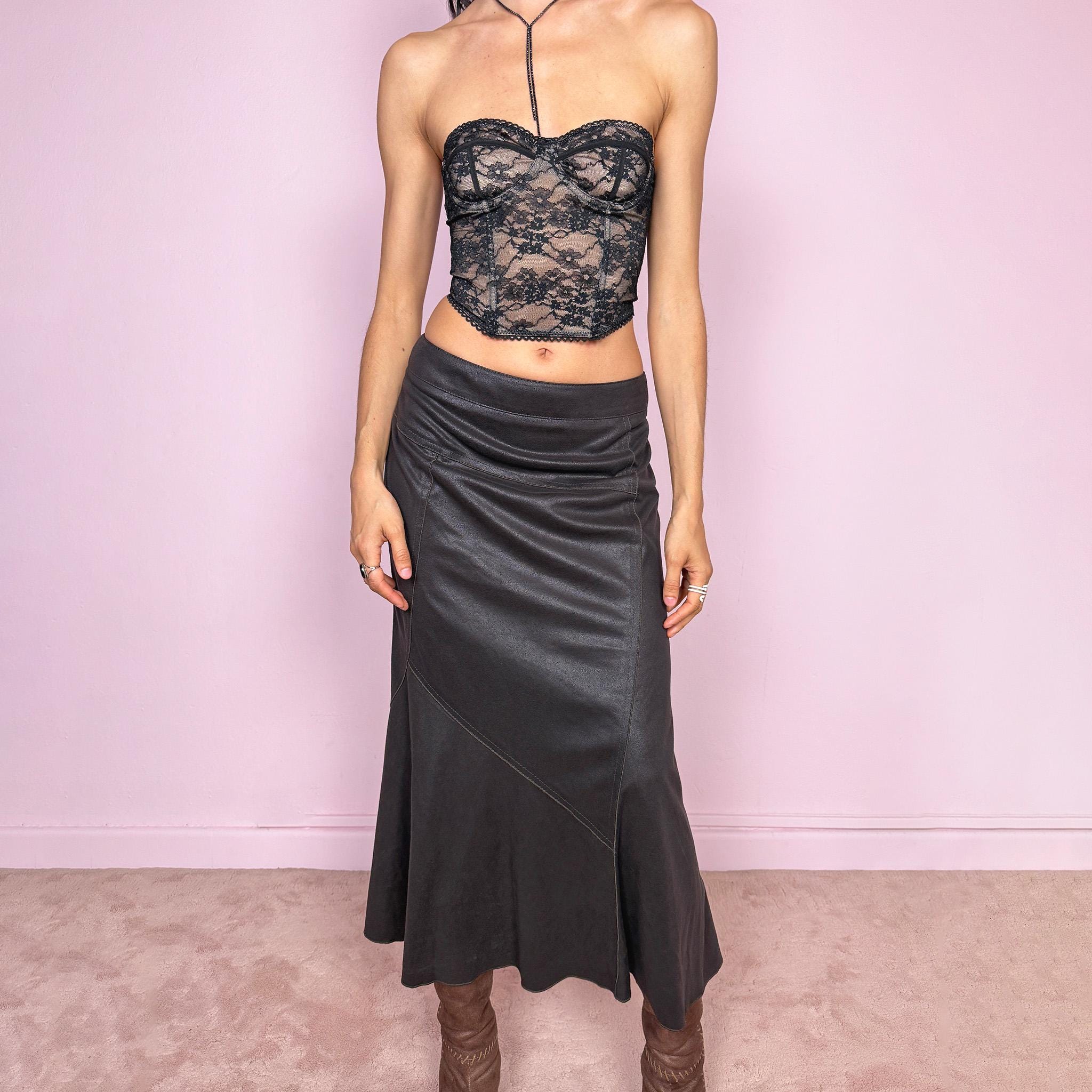 Vintage 2000s dark brown midi skirt with an avant garde minimal feel and soft faux suede texture. Features a flared hem with subtle paneling and a clean silhouette. Back zip closure, no stretch. Can be worn mid rise for size M or lower on the waist for size S. Made from polyamide and polyester. Excellent vintage condition.