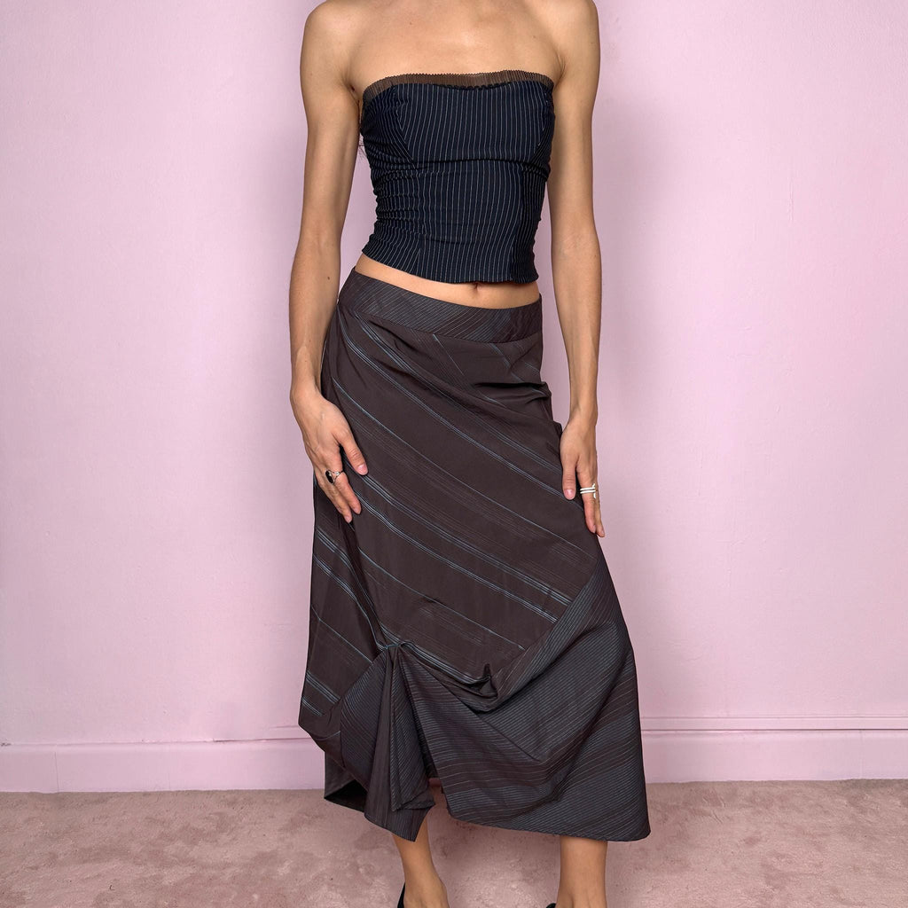 Vintage 2000s deconstructed avant-garde brown midi skirt with a blue diagonal pinstripe pattern and draped details. Features an asymmetrical hem and side zip closure. Structured no-stretch fabric creates a sculptural silhouette. Can be worn mid to low rise for XXS/XS or high-waisted for S. A dark, dystopian, fairycore grunge futuristic piece. Made by a French brand. Excellent vintage condition.