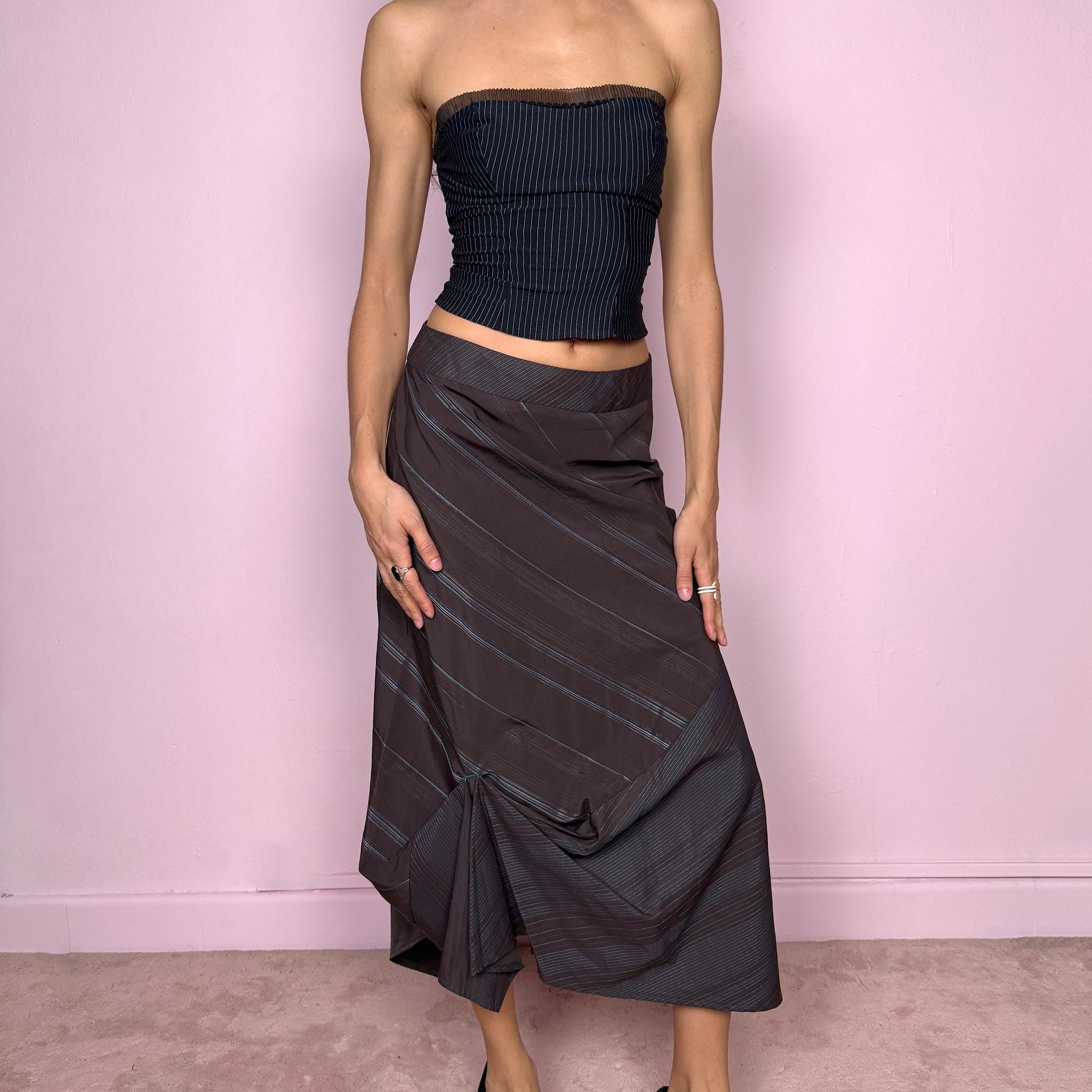 Vintage 2000s deconstructed avant-garde brown midi skirt with a blue diagonal pinstripe pattern and draped details. Features an asymmetrical hem and side zip closure. Structured no-stretch fabric creates a sculptural silhouette. Can be worn mid to low rise for XXS/XS or high-waisted for S. A dark, dystopian, fairycore grunge futuristic piece. Made by a French brand. Excellent vintage condition.