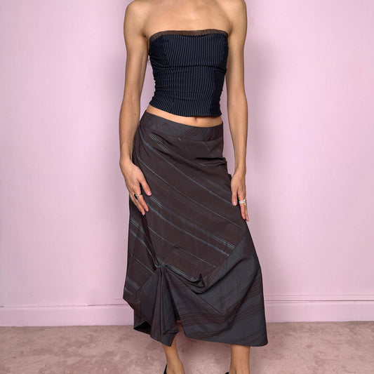 Vintage 2000s deconstructed avant-garde brown midi skirt with a blue diagonal pinstripe pattern and draped details. Features an asymmetrical hem and side zip closure. Structured no-stretch fabric creates a sculptural silhouette. Can be worn mid to low rise for XXS/XS or high-waisted for S. A dark, dystopian, fairycore grunge futuristic piece. Made by a French brand. Excellent vintage condition.