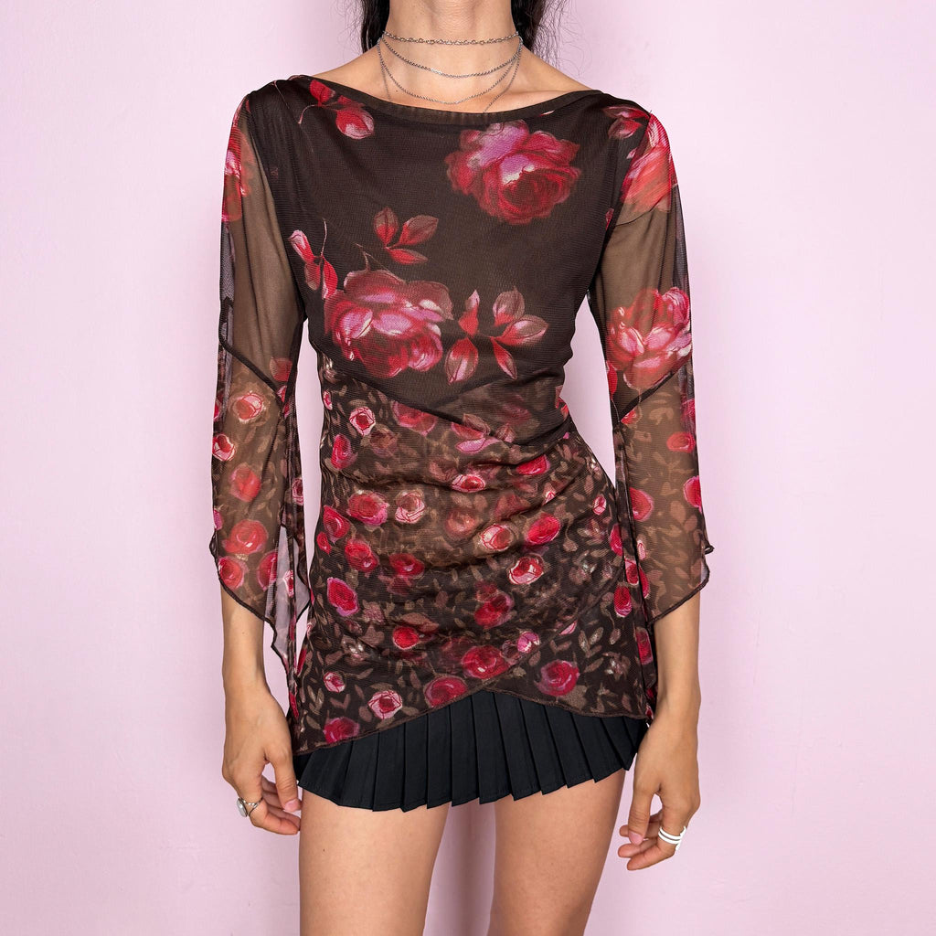 Vintage 2000s brown sheer mesh top with a fitted stretchy silhouette, asymmetric draped layered construction, wide boat neckline, and 3/4 bell sleeves. Red and pink floral rose print gives a romantic fairycore Y2K statement look. From a French brand. Fabric composition label is missing. Excellent vintage condition.