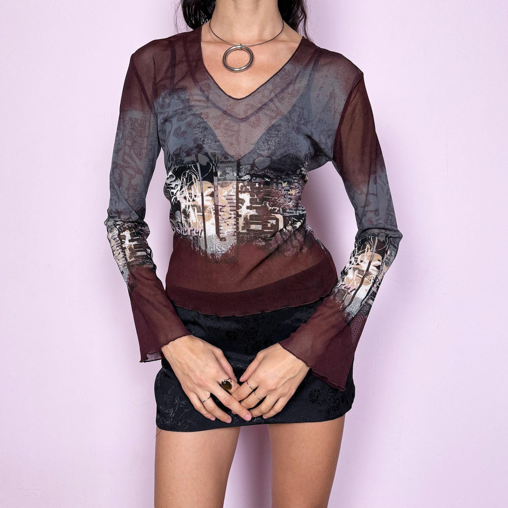 Vintage 2000s semi-sheer mesh top in gray and burgundy tones with an abstract city-inspired graphic print. Features a V neckline, long flared sleeves, and a stretchy fit. The deconstructed aesthetic give it a distinct cyber grunge and weird girl edge. Perfect for a casual yet statement everyday look. Excellent vintage condition.