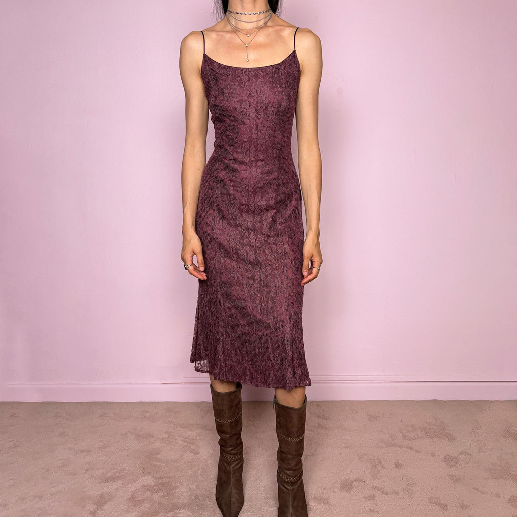 Vintage 2000s burgundy-purple midi slip dress featuring thin straps, a fitted body-skimming silhouette, and a lace overlay. Designed with a back zip closure, no stretch, and a slightly longer hem at the back for a soft, elegant drape. Made with a viscose-polyamide outer layer and polyester lining. A romantic minimal statement Y2K dress, perfect as an elevated evening piece. Excellent vintage condition.