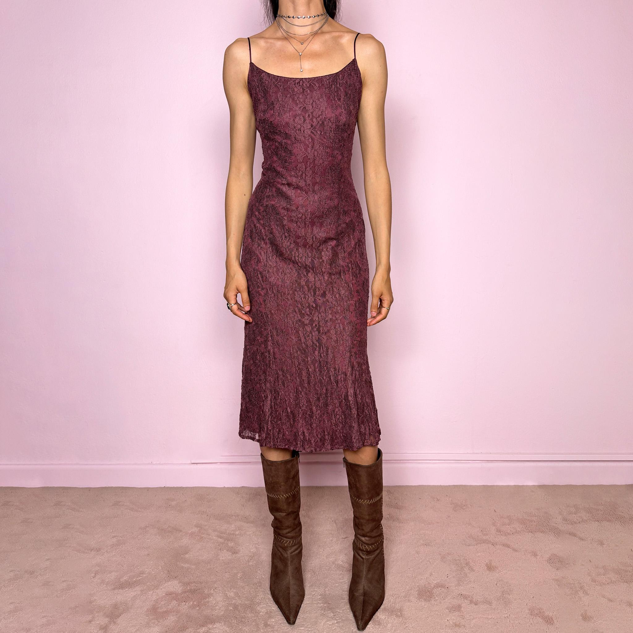 Vintage 2000s burgundy-purple midi slip dress featuring thin straps, a fitted body-skimming silhouette, and a lace overlay. Designed with a back zip closure, no stretch, and a slightly longer hem at the back for a soft, elegant drape. Made with a viscose-polyamide outer layer and polyester lining. A romantic minimal statement Y2K dress, perfect as an elevated evening piece. Excellent vintage condition.