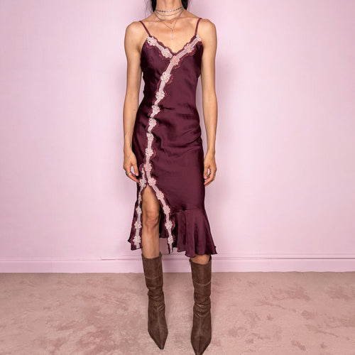 Vintage 2000s burgundy-plum satin-style slip midi dress. Features delicate adjustable straps, a romantic pink lace appliqué trim, asymmetric front detail, high front slit, and a softly flared ruffle hem. Designed in a smooth polyester fabric with no stretch and a feminine body-skimming silhouette. A romantic Y2K evening dress, perfect for dreamy soirées, made in France by a French brand. Excellent vintage condition.