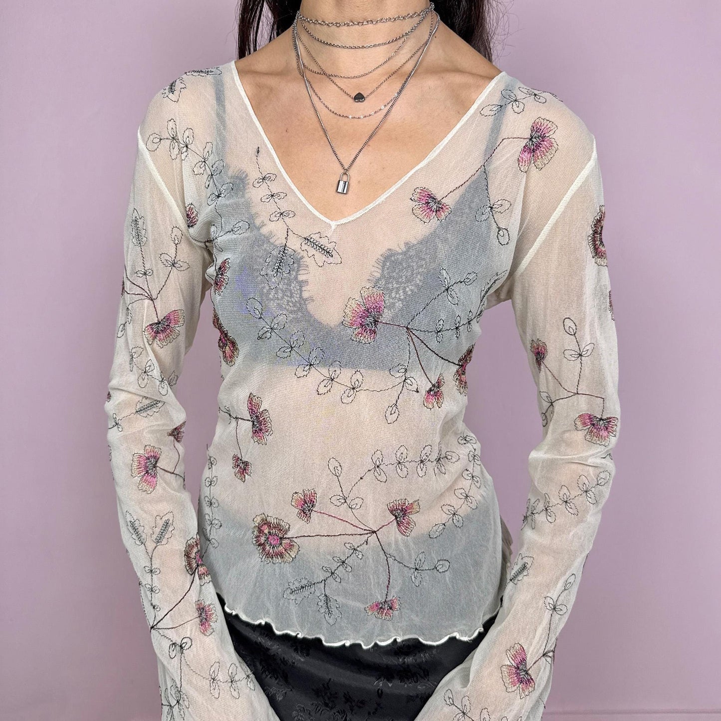 Vintage 2000s delicate soft ethereal cream mesh sheer long sleeve top with flared sleeves and a V-neck. Features floral embroidered details and a stretchy fitted silhouette with a subtle lettuce hem. Lightweight and airy, perfect for spring or summer layering with an artistic feel. Great vintage condition.