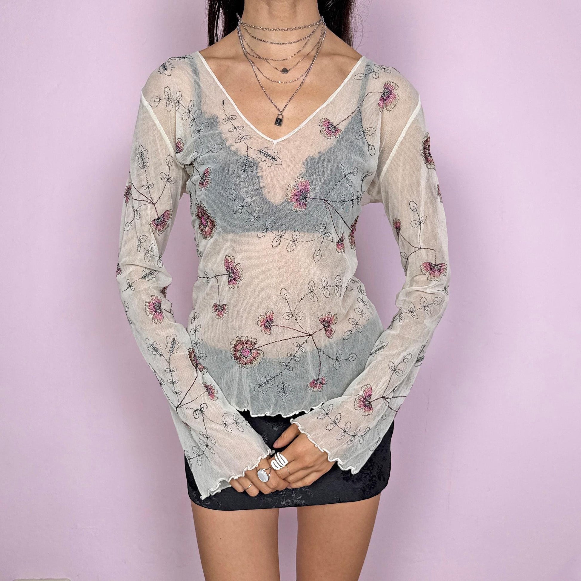 Vintage 2000s delicate soft ethereal cream mesh sheer long sleeve top with flared sleeves and a V-neck. Features floral embroidered details and a stretchy fitted silhouette with a subtle lettuce hem. Lightweight and airy, perfect for spring or summer layering with an artistic feel. Great vintage condition.