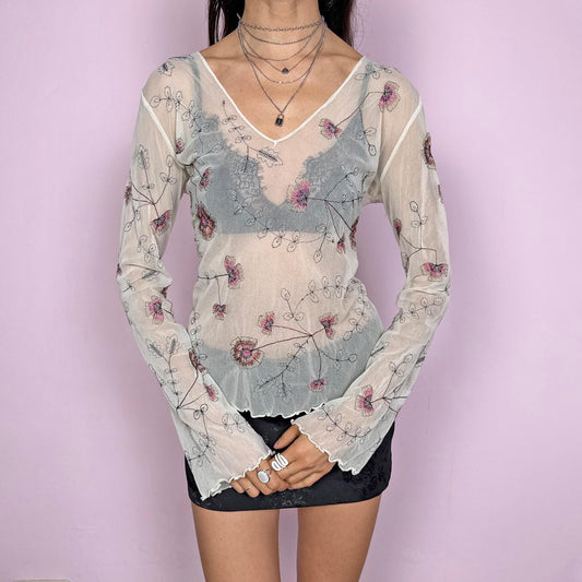 Vintage 2000s delicate soft ethereal cream mesh sheer long sleeve top with flared sleeves and a V-neck. Features floral embroidered details and a stretchy fitted silhouette with a subtle lettuce hem. Lightweight and airy, perfect for spring or summer layering with an artistic feel. Great vintage condition.