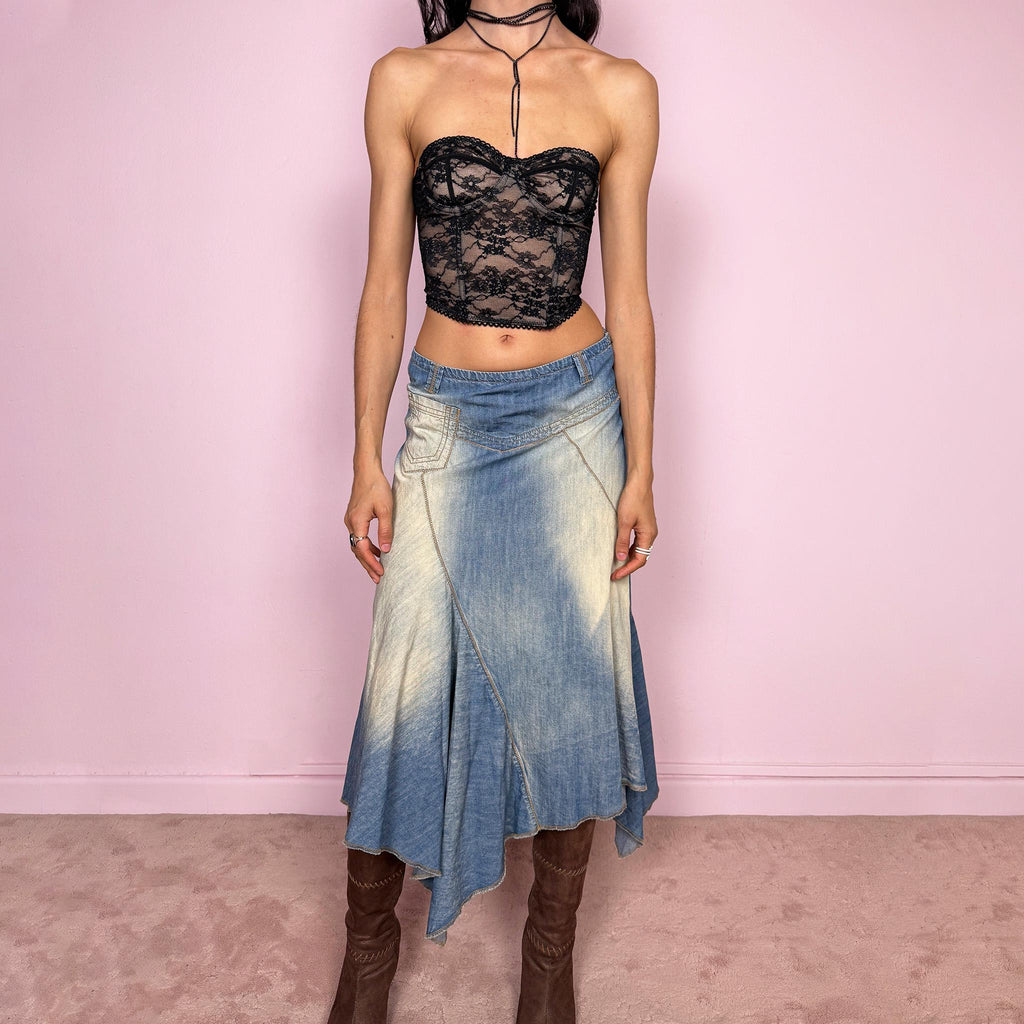 Vintage 2000s blue denim midi skirt with an avant garde flared asymmetric silhouette and panelled construction. Features a soft faded wash, raw hem detailing, and side zip closure, no stretch. Unique bold design perfect for summer festival styling. Can be worn high waisted for size M or mid to low rise for XS/S. Great vintage condition.
