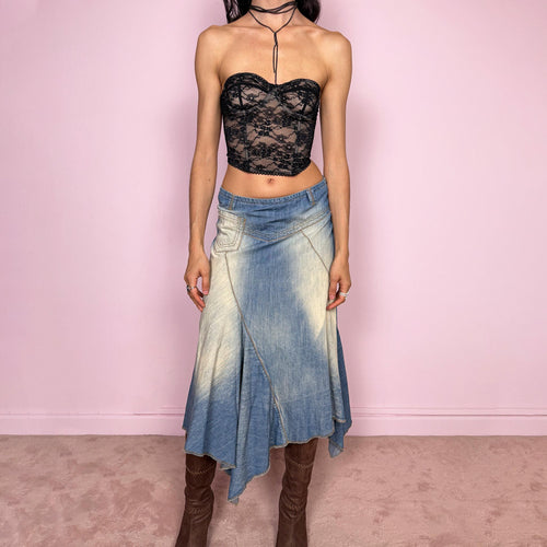 Vintage 2000s blue denim midi skirt with an avant garde flared asymmetric silhouette and panelled construction. Features a soft faded wash, raw hem detailing, and side zip closure, no stretch. Unique bold design perfect for summer festival styling. Can be worn high waisted for size M or mid to low rise for XS/S. Great vintage condition.