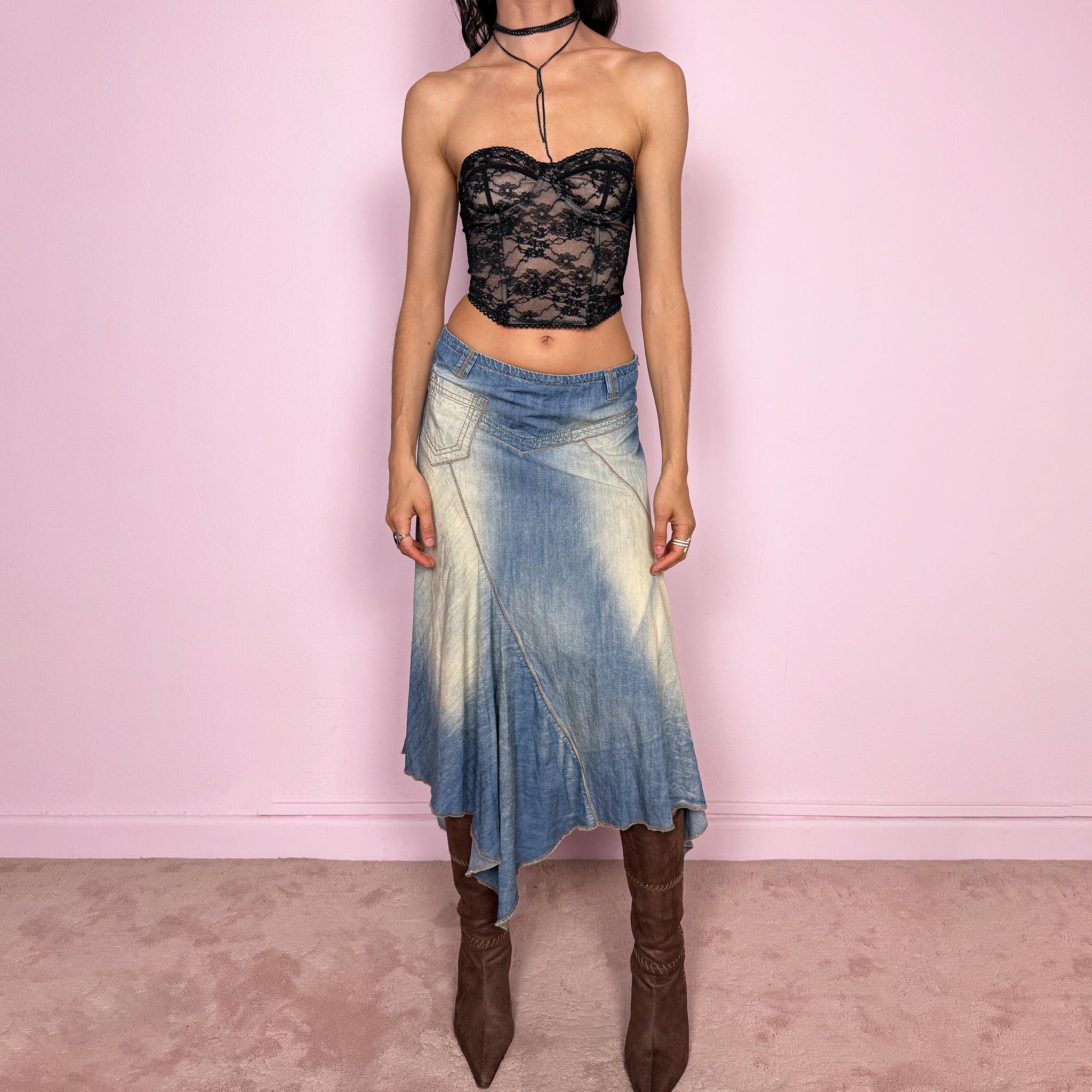 Vintage 2000s blue denim midi skirt with an avant garde flared asymmetric silhouette and panelled construction. Features a soft faded wash, raw hem detailing, and side zip closure, no stretch. Unique bold design perfect for summer festival styling. Can be worn high waisted for size M or mid to low rise for XS/S. Great vintage condition.