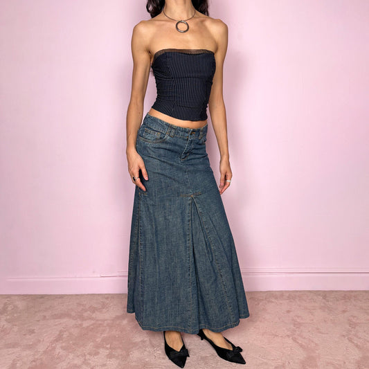 Vintage 2000s blue denim maxi skirt featuring a unique godet panel construction that creates a flared silhouette. Classic pockets and front zip closure. Structured denim with no stretch and a statement streetwear look. Can be worn mid rise for size XS or lower on the waist for size XXS. Made from 100% cotton. Excellent vintage condition.