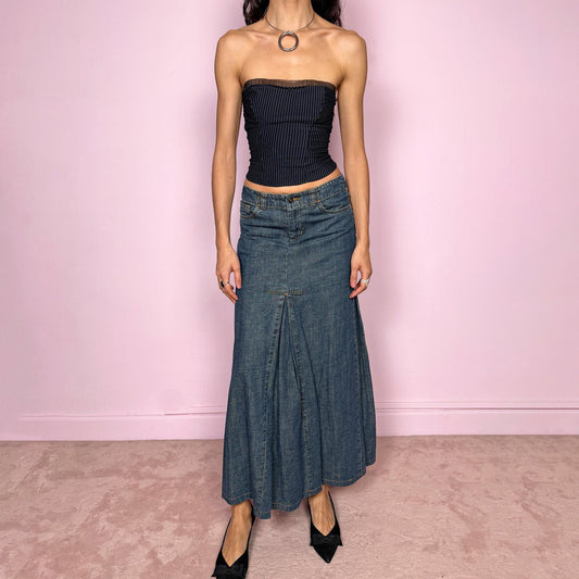 Vintage 2000s blue denim maxi skirt featuring a unique godet panel construction that creates a flared silhouette. Classic pockets and front zip closure. Structured denim with no stretch and a statement streetwear look. Can be worn mid rise for size XS or lower on the waist for size XXS. Made from 100% cotton. Excellent vintage condition.