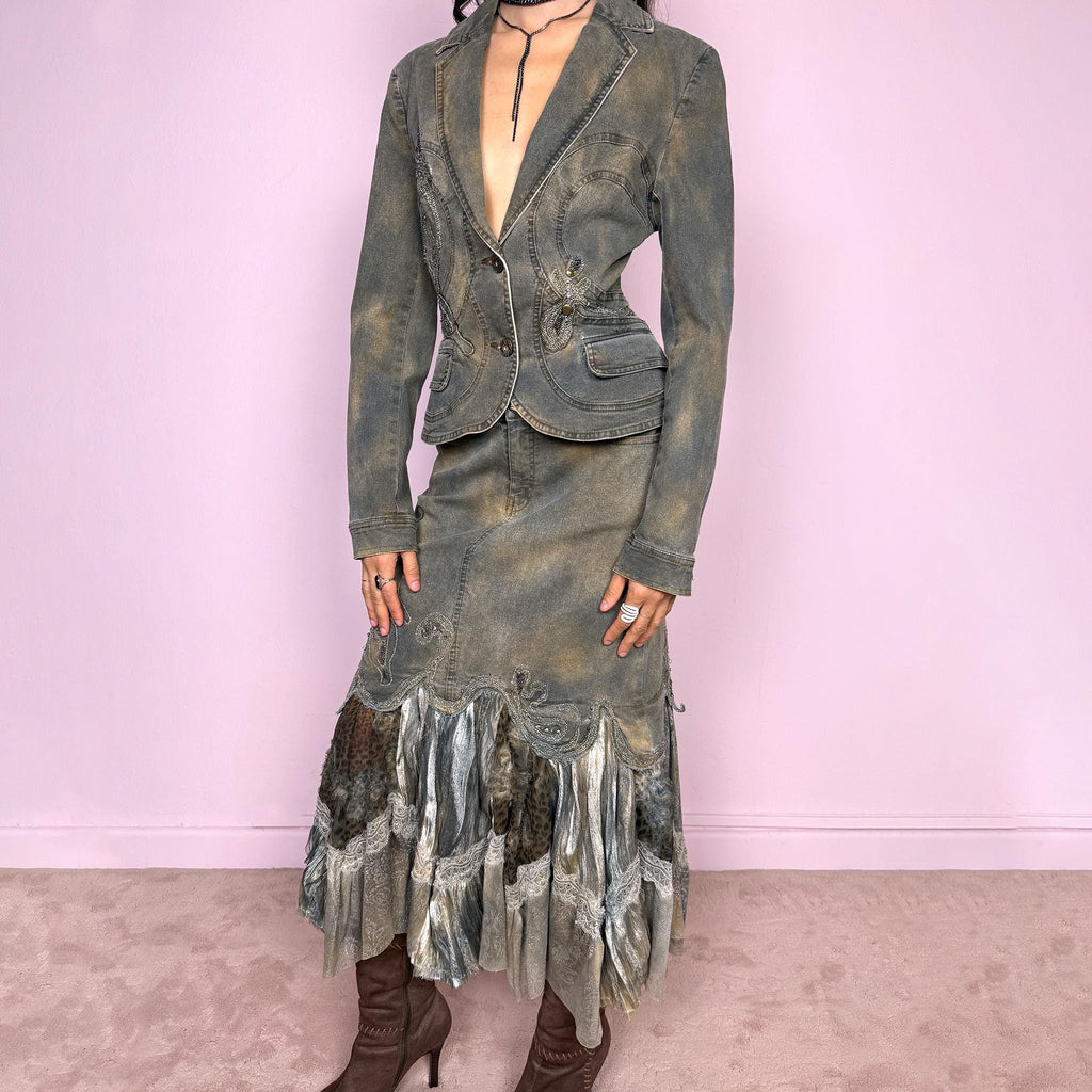 Vintage 2000s green-gray denim set with a faded tie-dye effect, including a tailored blazer-style jacket and matching mid-rise midi skirt. Both pieces are slightly stretchy and embellished with beads and rhinestones. The skirt features a dramatic trumpet ruffle mixed-fabric hem for a striking silhouette. Iconic statement Y2K set. Made from 95% cotton and 5% spandex. Excellent vintage condition.