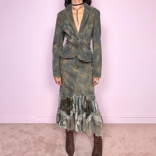 Vintage 2000s green-gray denim set with a faded tie-dye effect, including a tailored blazer-style jacket and matching mid-rise midi skirt. Both pieces are slightly stretchy and embellished with beads and rhinestones. The skirt features a dramatic trumpet ruffle mixed-fabric hem for a striking silhouette. Iconic statement Y2K set. Made from 95% cotton and 5% spandex. Excellent vintage condition.