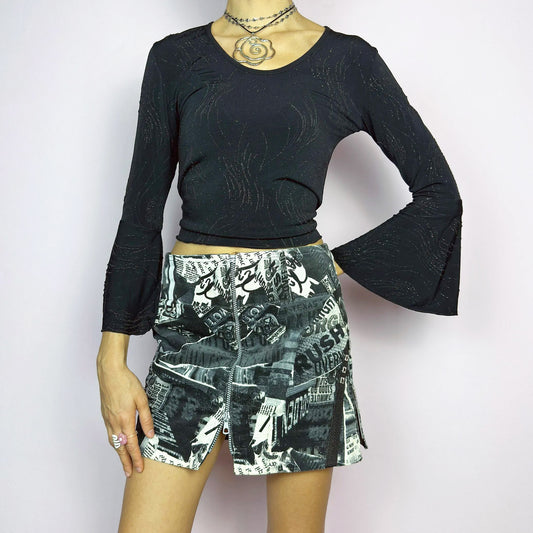 The Y2K Collage Print Mini Skirt is a vintage 2000s piece, featuring an all-over newspaper-inspired collage print in black and white. Designed with a low-rise fit, adjustable front zipper closure and pockets. The added cargo-style details and side zippers enhance its grunge aesthetic, making it perfect for alt, cyber, or casual looks.
