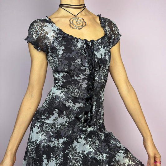 The Y2K Asymmetric Mesh Mini Dress is a vintage 2000s piece featuring a floral semi-sheer overlay with a corset-style lace-up front. Designed with a romantic sweetheart neckline, short ruffle cap sleeves, and an asymmetrical. adult world shop