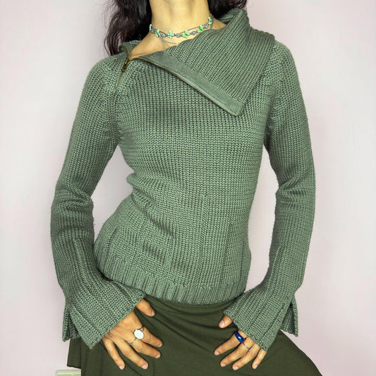 This vintage 2000s green knit sweater features a dramatic asymmetrical collar with exposed zipper and flared split cuffs. Ideal for deconstructed layering on autumn days, it radiates fairy grunge energy with a streetwear edge. A fluffy Y2K piece made of acrylic and wool for cozy warmth. Great vintage condition.
