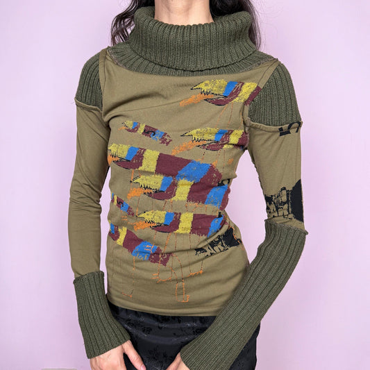 Avant garde vintage 2000s khaki green deconstructed long sleeve top with a knit turtleneck, ribbed knitted cuffs, and patchwork construction. Features multicolored embroidered details with a futuristic dystopian weird girl aesthetic. Ideal for autumn or winter statement layering. Made in Portugal from a stretchy polyamide blend by Desigual. Great vintage condition.