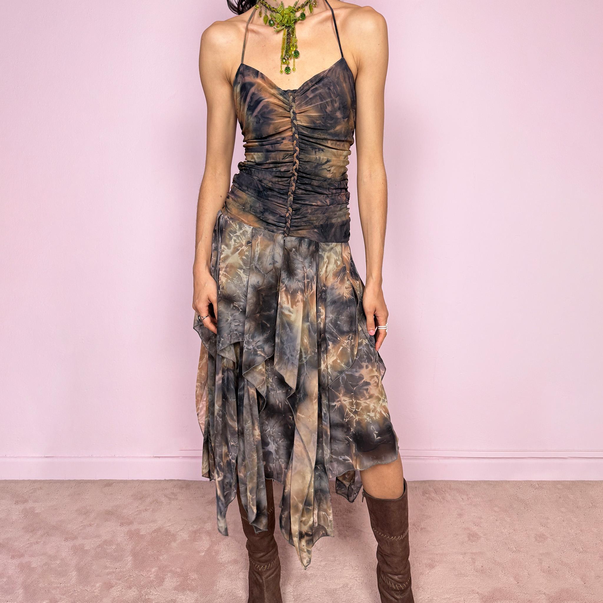 Vintage 2000s multicolored halter midi dress with a tie-neck design and ruched stretchy bodice for a flattering fitted silhouette. Features a dramatic asymmetric handkerchief hem and bold psychedelic tie-dye print in earthy tones. Stunning statement piece perfect for festivals, boho fairy styling, or summer events. Made in USA from polyester. Excellent vintage condition.