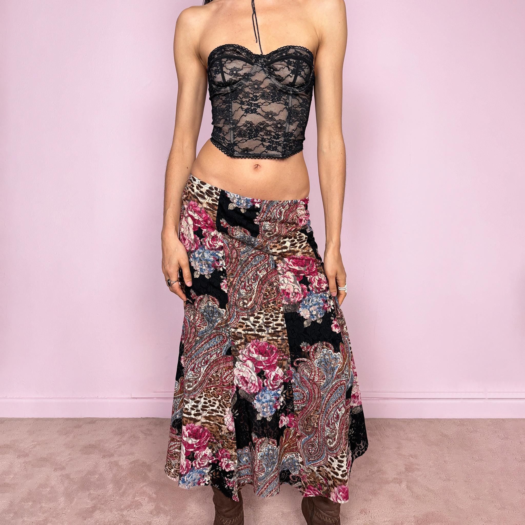 Vintage 2000s lace midi skirt with a whimsical maximalist mix of floral, paisley, and animal prints. Features multiple split hems and a stretchy elastic waistband for a flexible fit. Can be worn high waisted for size S or mid to low rise for XS. Made from a microfiber blend. Great vintage condition.