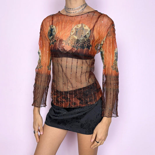Vintage 2000s sheer mesh long sleeve top in orange and brown with an abstract graphic print and sequin details. Transparent, delicate, and stretchy, perfect for whimsical boho and fairycore looks. Works as a statement party night top and ideal for creative layering. Excellent vintage condition.