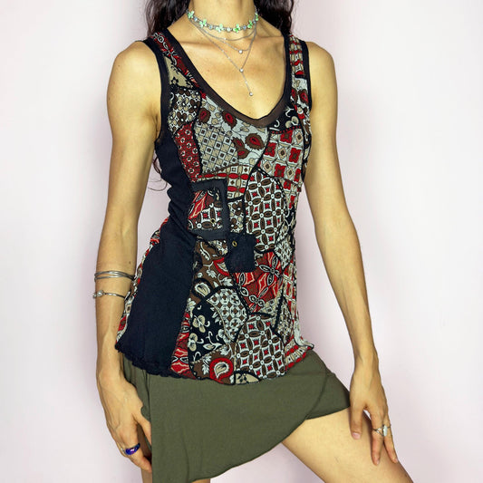 This vintage 2000s mesh tank top features a scarf-style patchwork print in black, red, taupe, and cream. Designed with a scoop neckline, sheer panels, and asymmetric lines for a deconstructed, collage-inspired look. A rare bold piece for alt wardrobes or maximalist summer styling. Made from lightweight stretch polyester elastane blend. Excellent vintage condition.