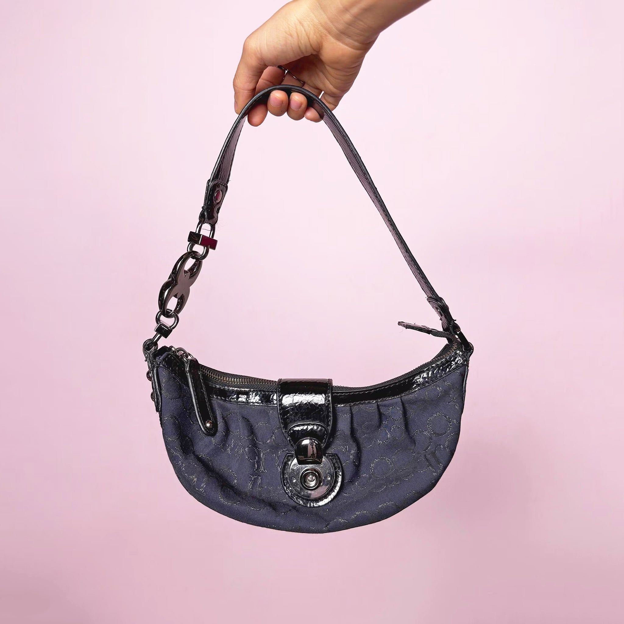 Vintage 2000s navy blue mini baguette-style shoulder bag by Roccobarocco. Features signature monogram canvas with glossy black patent details, sculptural hardware, zip closure, and push-down turn-lock closure. Made in Italy. Great vintage condition.