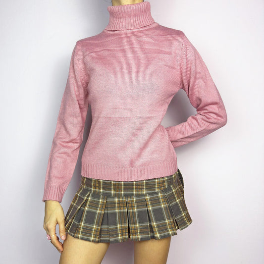 This Y2K Pink Turtleneck Sweater is a cozy 2000s essential with a minimalist vintage aesthetic. Crafted from a soft, knit fabric in a muted pastel pink, it features a classic high turtleneck, a fitted silhouette for a flattering look and long sleeves with ribbed cuffs. Ideal for casual or preppy winter styles. Made from an acrylic blend knit. Great vintage condition.