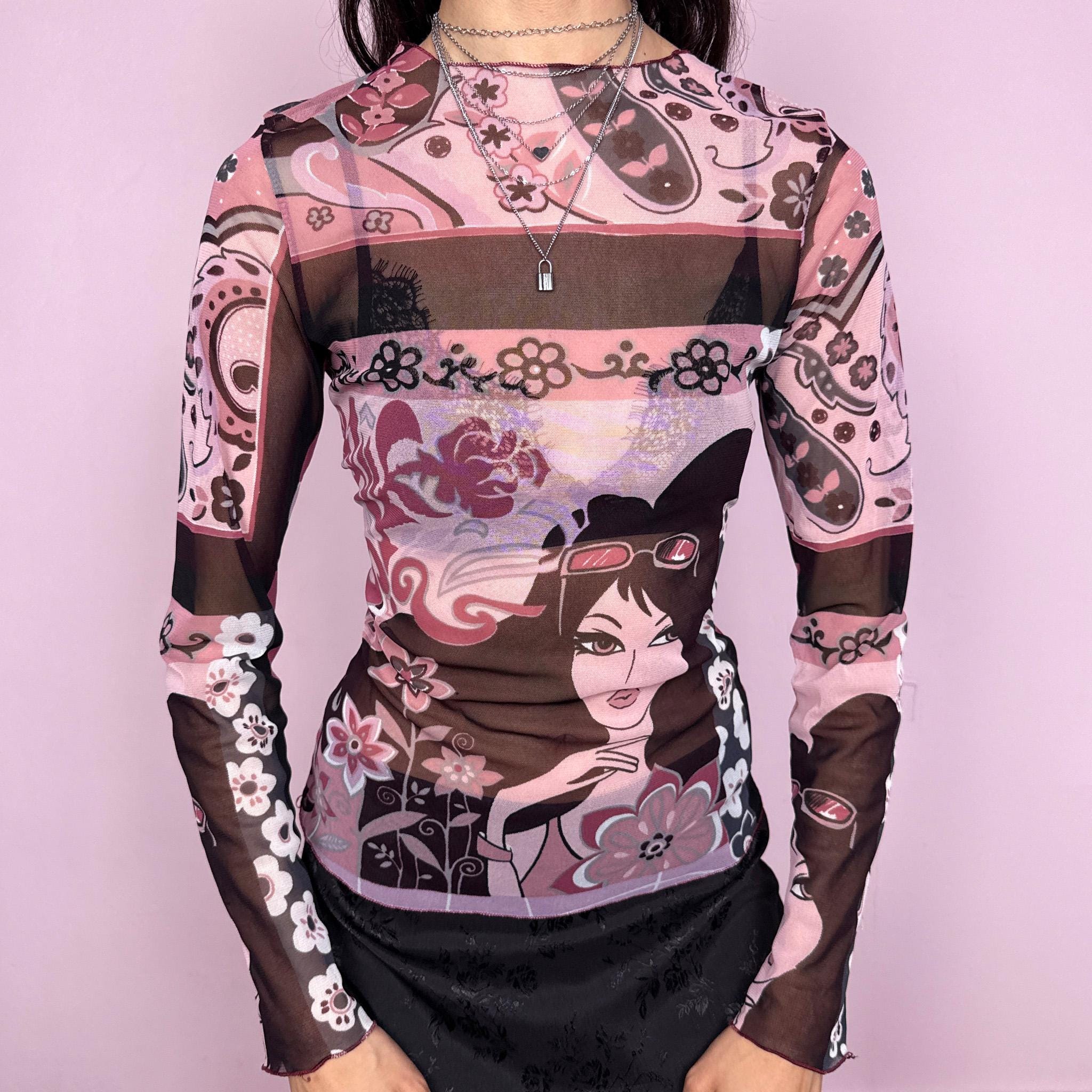 Vintage 2000s maximalist pink burgundy abstract floral graphic print mesh long sleeve semi sheer fitted stretchy top featuring a woman face motif. Lightweight with a bold statement design, perfect for spring or summer layering. Made in France from polyamide. Excellent vintage condition.