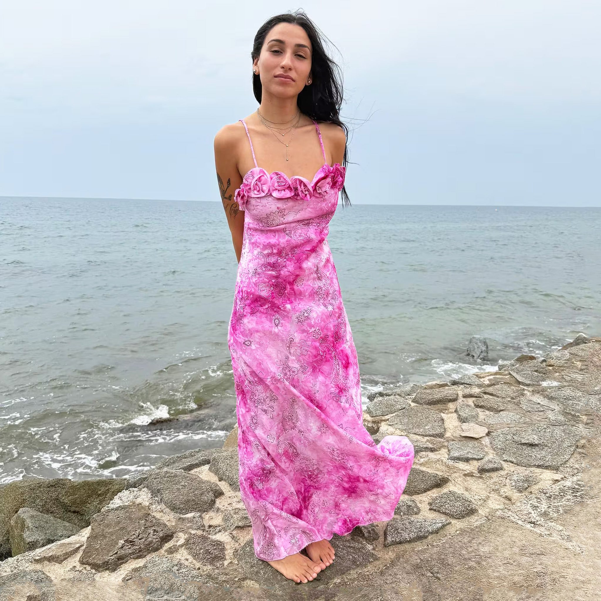 Vintage 2000s slip dress with a vivid pink tie-dye paisley print, rosette appliqué neckline, and long flowing silhouette. Comes with a matching scarf for versatile styling, ideal for summer weddings, proms, formal parties, bridal, evening, or statement occasions. Made in France from a non-stretch polyester blend. Excellent vintage condition.