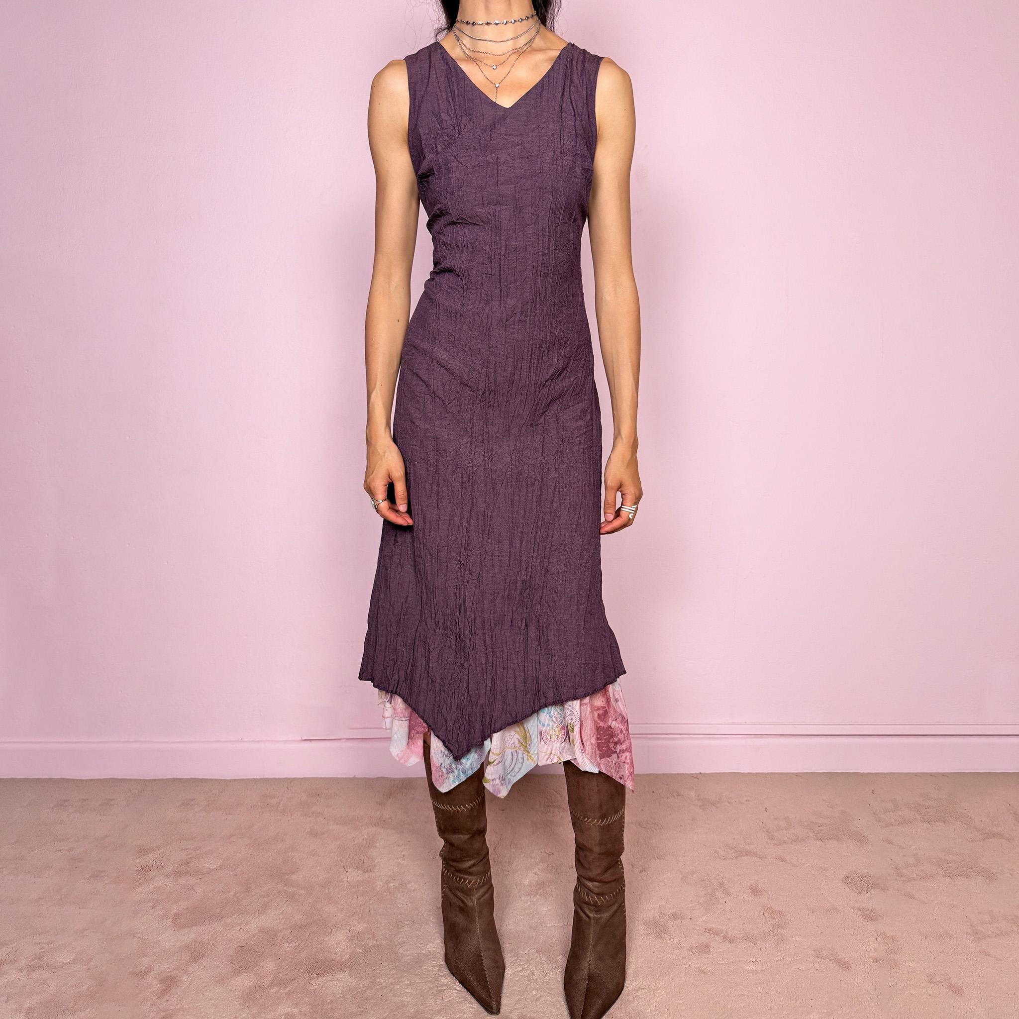 Vintage 2000s purple sleeveless midi dress with a minimal avant-garde look, no stretch, V-neckline, crinkle texture, flowy fit, side zip closure, and an asymmetric hem with graphic print mesh ruffle detail. Made by a French brand from a polyester viscose blend. Great vintage condition.