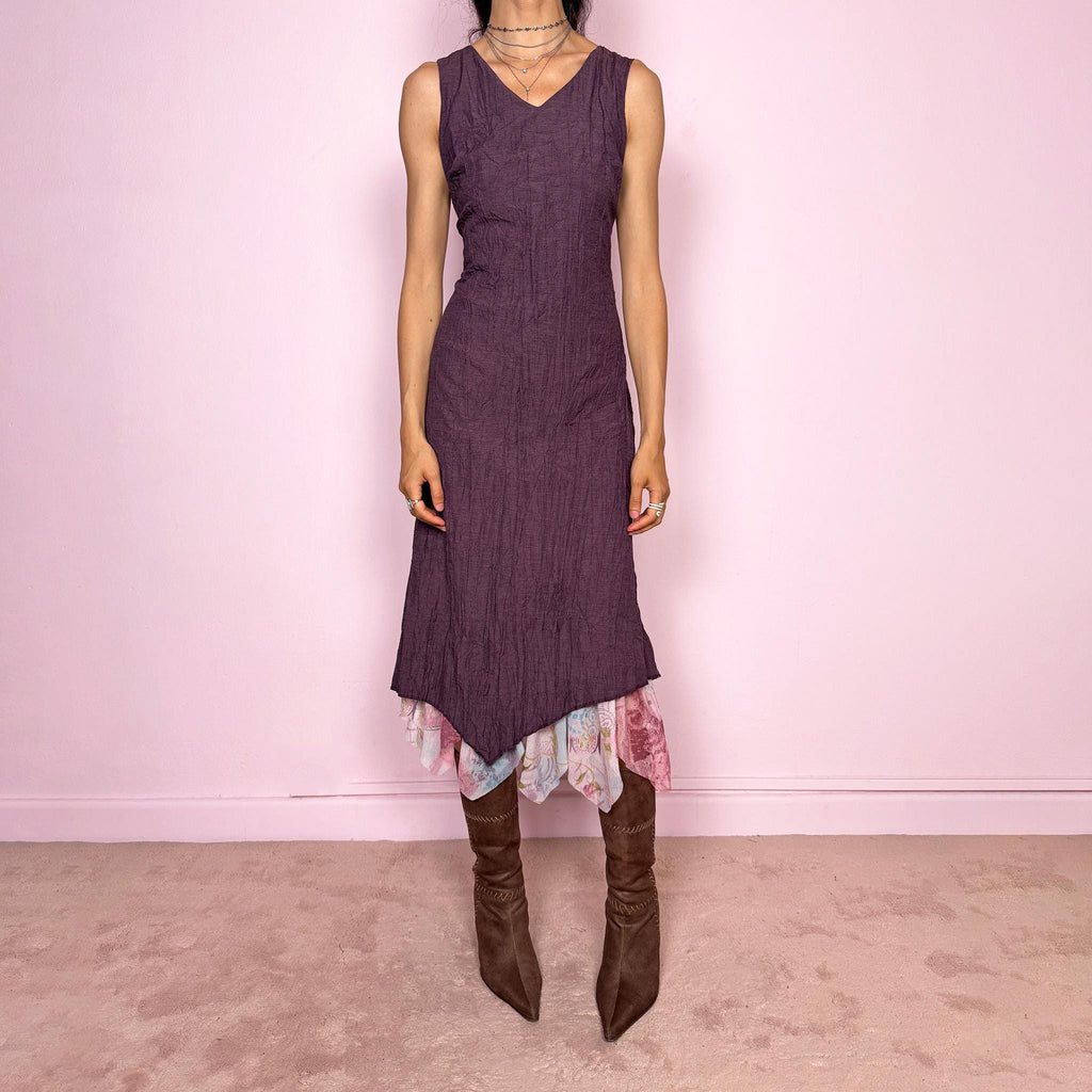 Vintage 2000s purple sleeveless midi dress with a minimal avant-garde look, no stretch, V-neckline, crinkle texture, flowy fit, side zip closure, and an asymmetric hem with graphic print mesh ruffle detail. Made by a French brand from a polyester viscose blend. Great vintage condition.