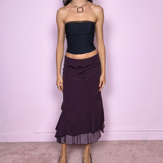 Vintage 2000s avant garde purple midi skirt with a deconstructed draped design, ruched detailing, and an asymmetric ruffle hem. Side zip closure with no stretch. Can be worn mid rise for size S or high waisted for size M. Made by a French brand. Excellent vintage condition.