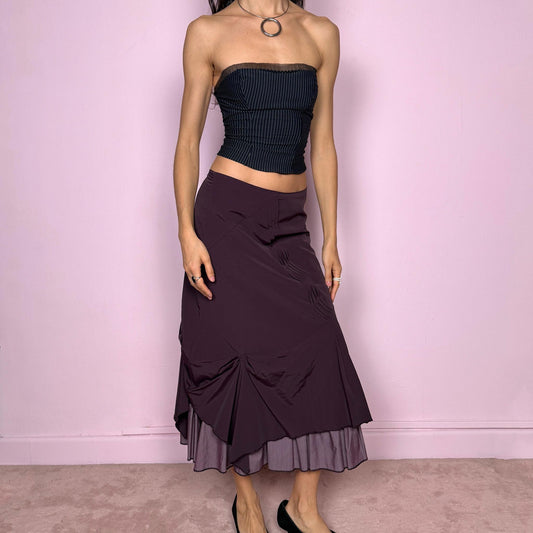 Vintage 2000s avant garde purple midi skirt with a deconstructed draped design, ruched detailing, and an asymmetric ruffle hem. Side zip closure with no stretch. Can be worn mid rise for size S or high waisted for size M. Made by a French brand. Excellent vintage condition.