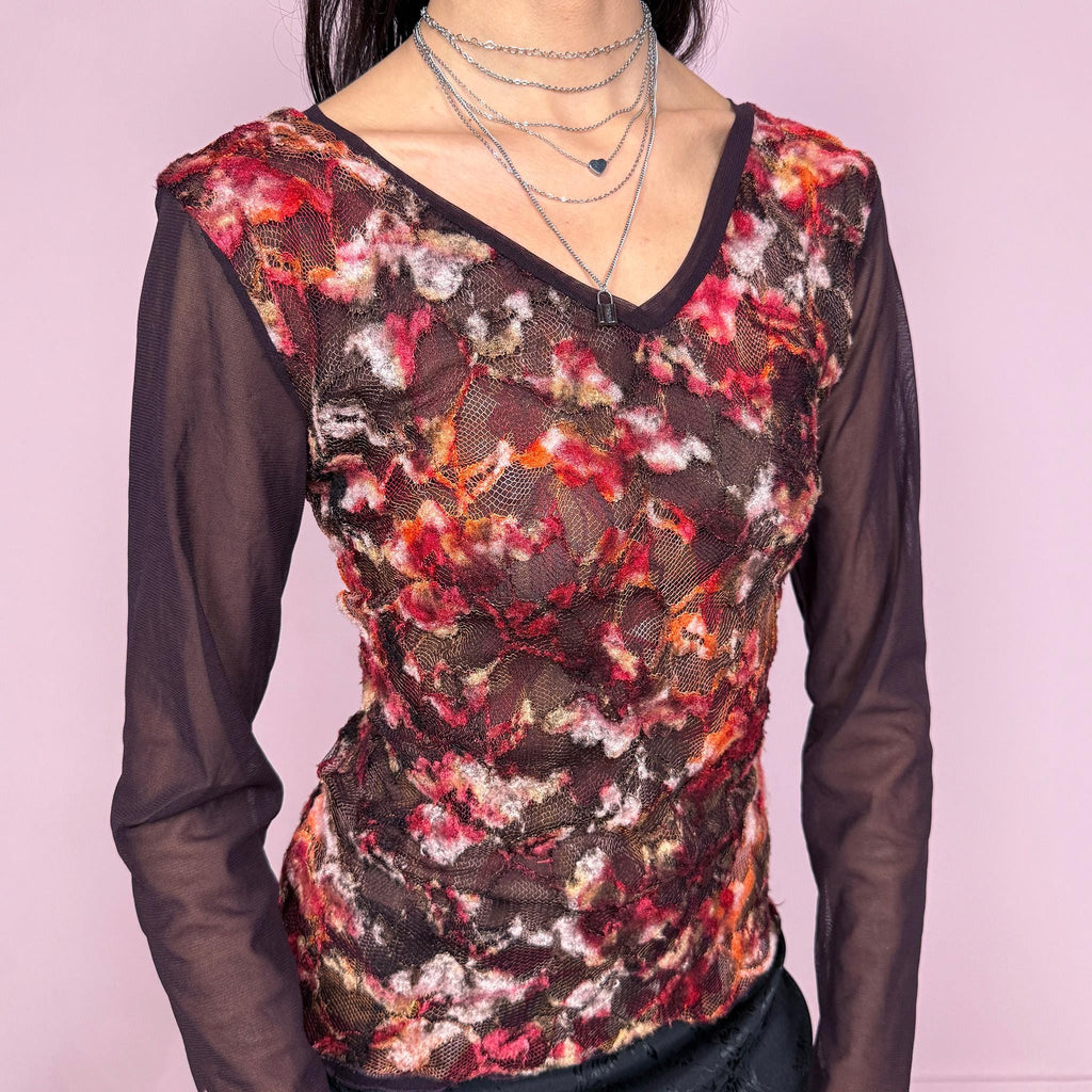 Vintage 2000s romantic dark purple semi sheer long sleeve top featuring layered mesh construction with a textured lace overlay in red and burgundy tones, creating a rich dimensional effect. Stretchy with a fitted silhouette, perfect for evening, spring, or night wear with a soft fairycore feel. Made in France from a polyester blend. Great vintage condition.
