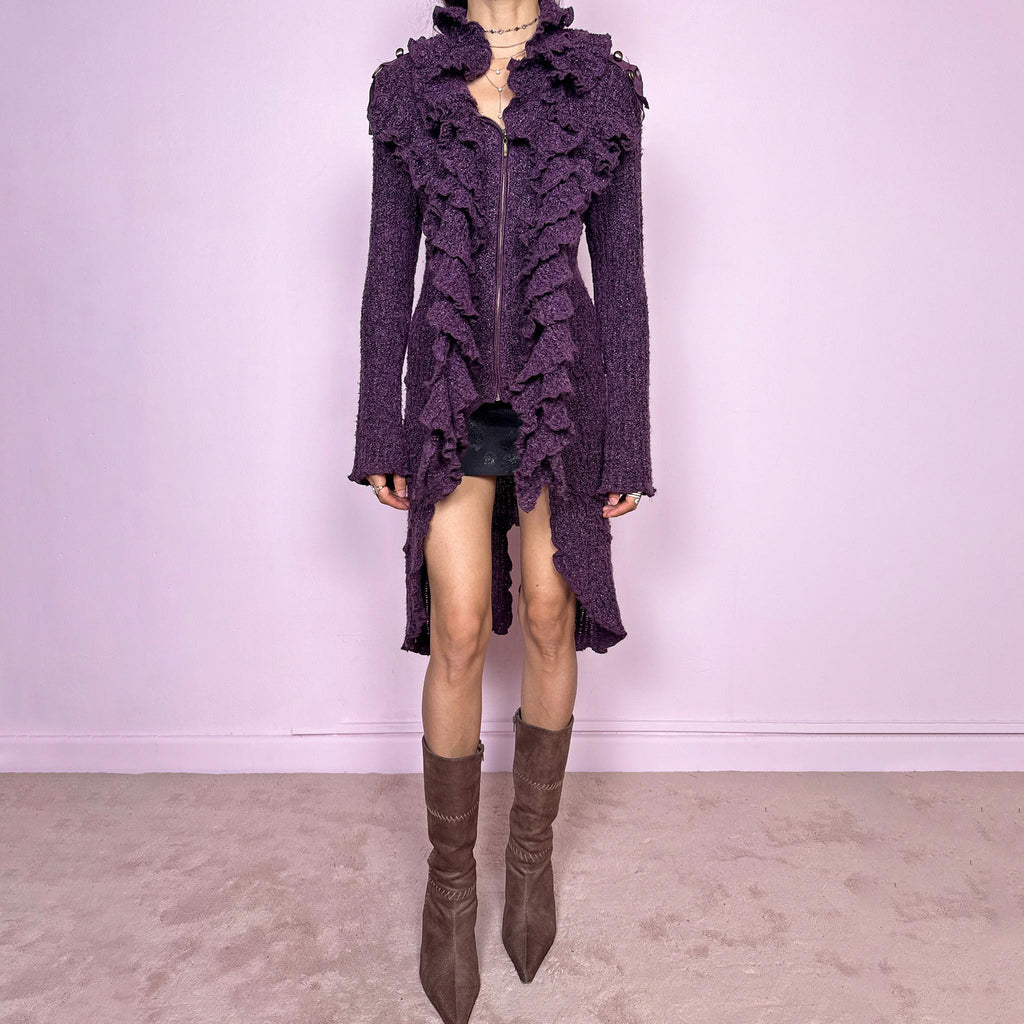 Vintage 2000s purple and black longline crazy cardigan with metallic thread, a zip-front closure, long bell sleeves, sculptural ruffle neckline, 3D cascading front ruffles, and an asymmetric high-low hem. Dramatic, extravagant, and bold for winter. Made by a French brand from an acrylic polyester blend. Great vintage condition.