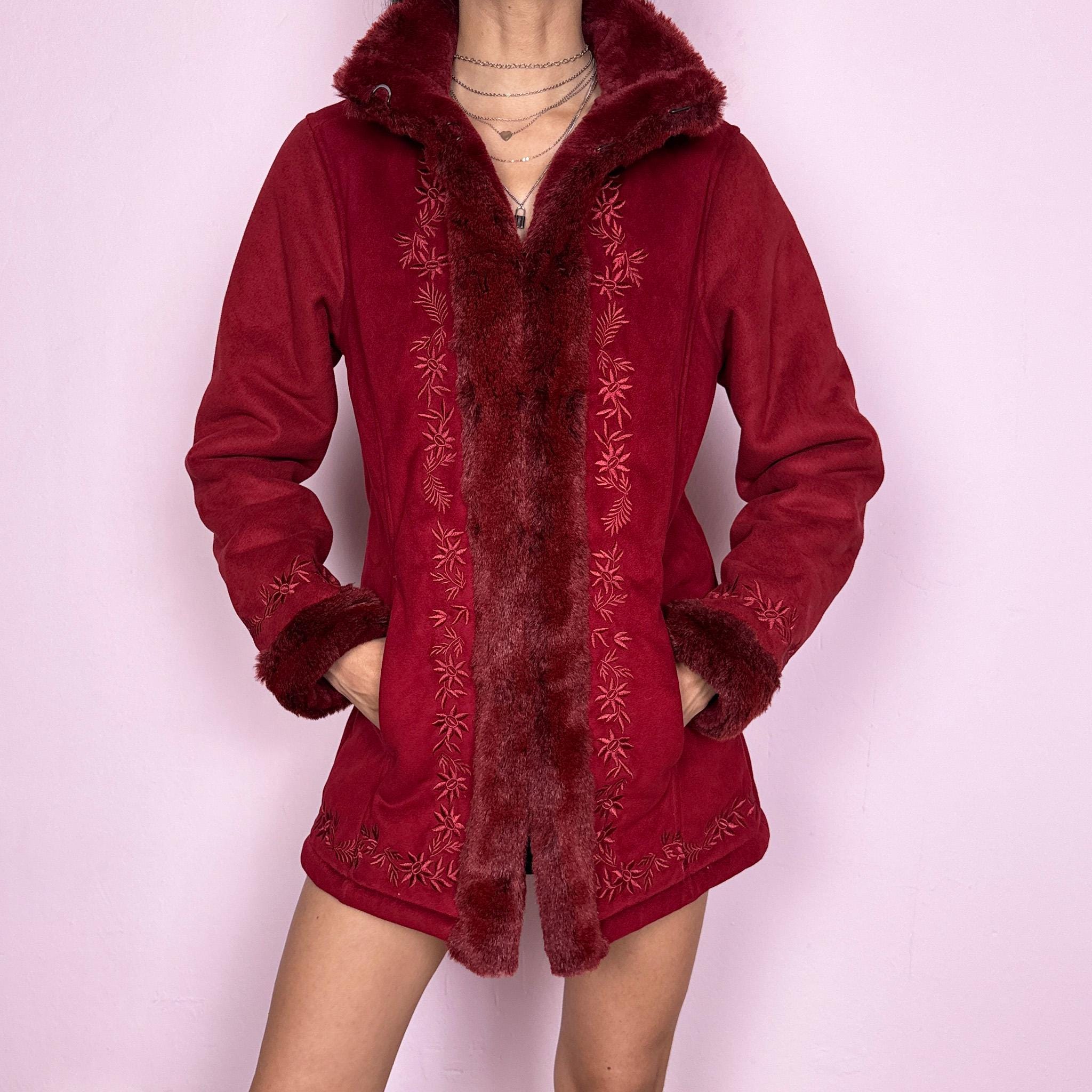 Vintage 2000s Penny Lane style coat in a deep red tone featuring rich embroidery and plush faux fur trim at the collar, cuffs, and interior. Designed with a cozy structured fit, pockets, and hook closure for a bold bohemian statement. Perfect for winter with a soft fairycore feel. Made from a polyester acrylic blend. Excellent vintage condition.