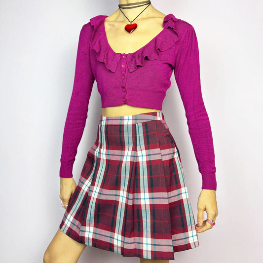 The Y2K Red Plaid Pleated Mini Skirt is a vintage 2000s essential featuring a structured pleated design in a bold red, navy, and white plaid pattern. Made from a woven fabric, it’s perfect for preppy, punk, or casual outfits. It has a back zipper closure and pockets, making it an ideal piece for autumn wardrobe.