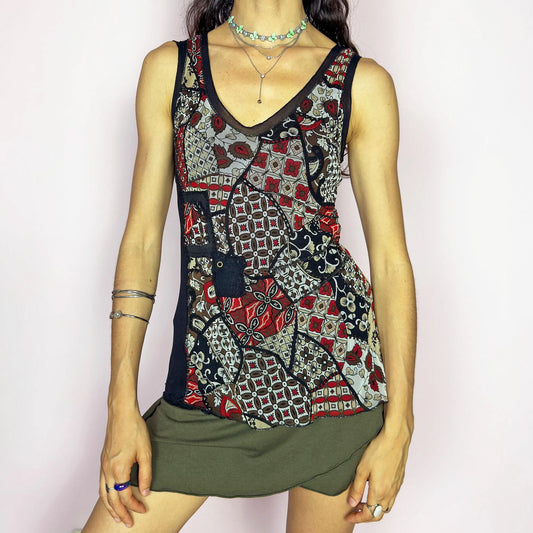 This vintage 2000s mesh tank top features a scarf-style patchwork print in black, red, taupe, and cream. Designed with a scoop neckline, sheer panels, and asymmetric lines for a deconstructed, collage-inspired look. A rare bold piece for alt wardrobes or maximalist summer styling. Made from lightweight stretch polyester elastane blend. Excellent vintage condition.