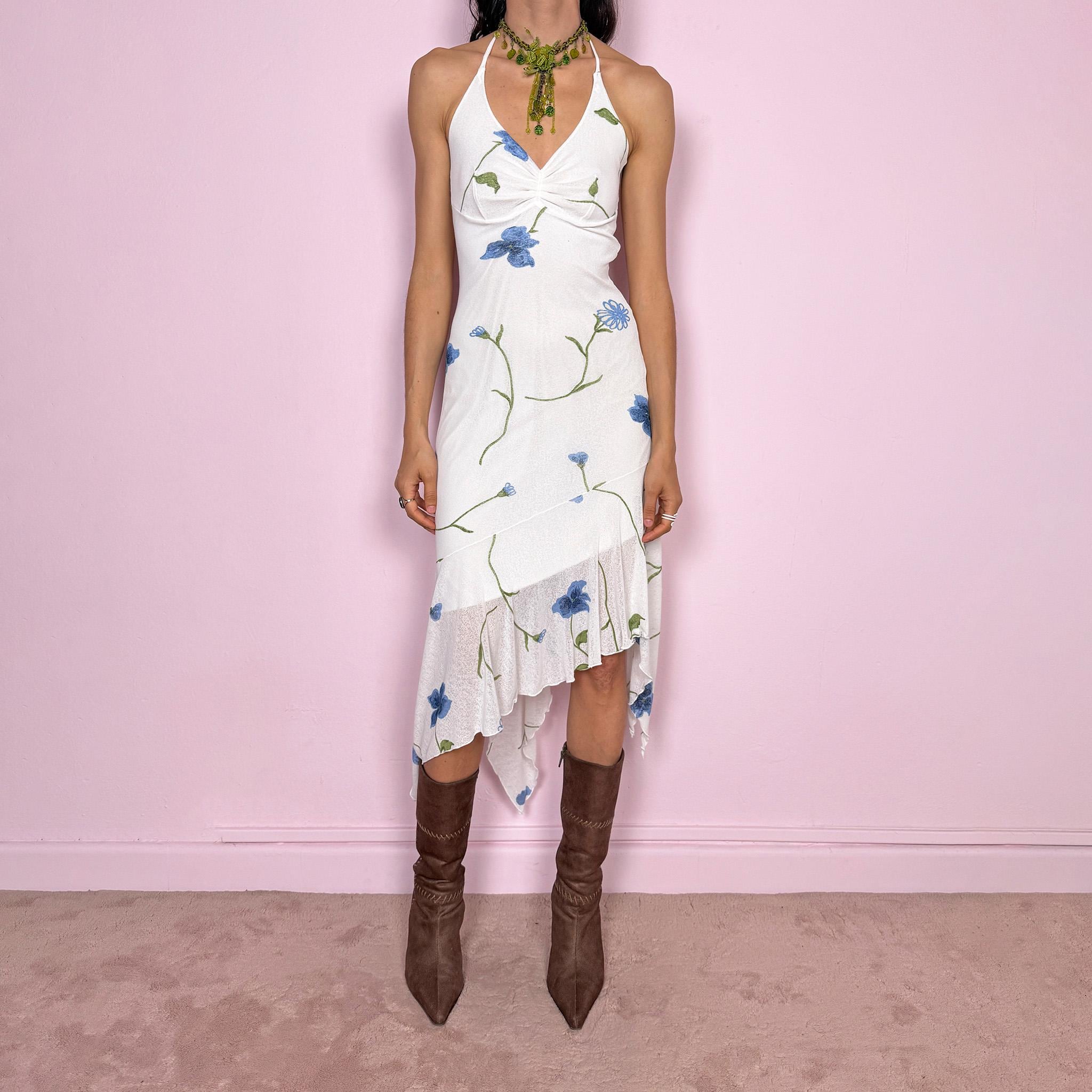 Vintage 2000s white halter midi dress with blue and green floral print and a flattering tie-neck design. Made from stretchy mesh with lining for a fitted silhouette. Features an asymmetric ruffle hem for fluid movement. Perfect for summer parties, boho styling, or soft coquette looks. Great vintage condition.