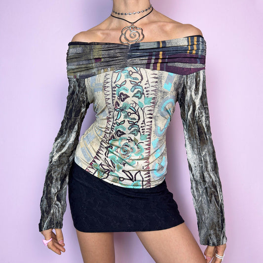 The Y2K Art Print Top is a vintage 2000s off-the-shoulder long sleeve designed by Legatte Jeans. This artsy piece features a unique patchwork-style mixed print with floral, stripe, and abstract motifs in a moody palette of cream, sage, burgundy, and metallic gray. The body is made from soft, stretchy fabric, while the semi-sheer mesh sleeves add a delicate contrast. Pleated details along the neckline elevate its sculptural silhouette. adult world shop