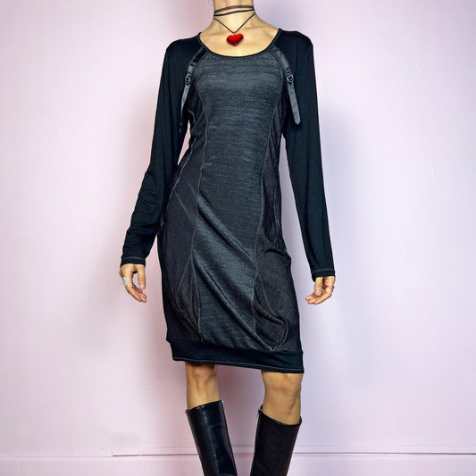 The Y2K Black Deconstructed Mini Dress is a rare cyber-inspired piece featuring a body-hugging silhouette with a subtle sheen. The dress combines soft jersey and panels with contrast stitching for a deconstructed effect. Long sleeves and a rounded neckline are accented by satin strap and D-ring details. Stretchy and sleek, it&#39;s perfect for dystopian minimalism, post-apocalyptic fashion, or edgy everyday wear. Made in France. Great vintage condition.
