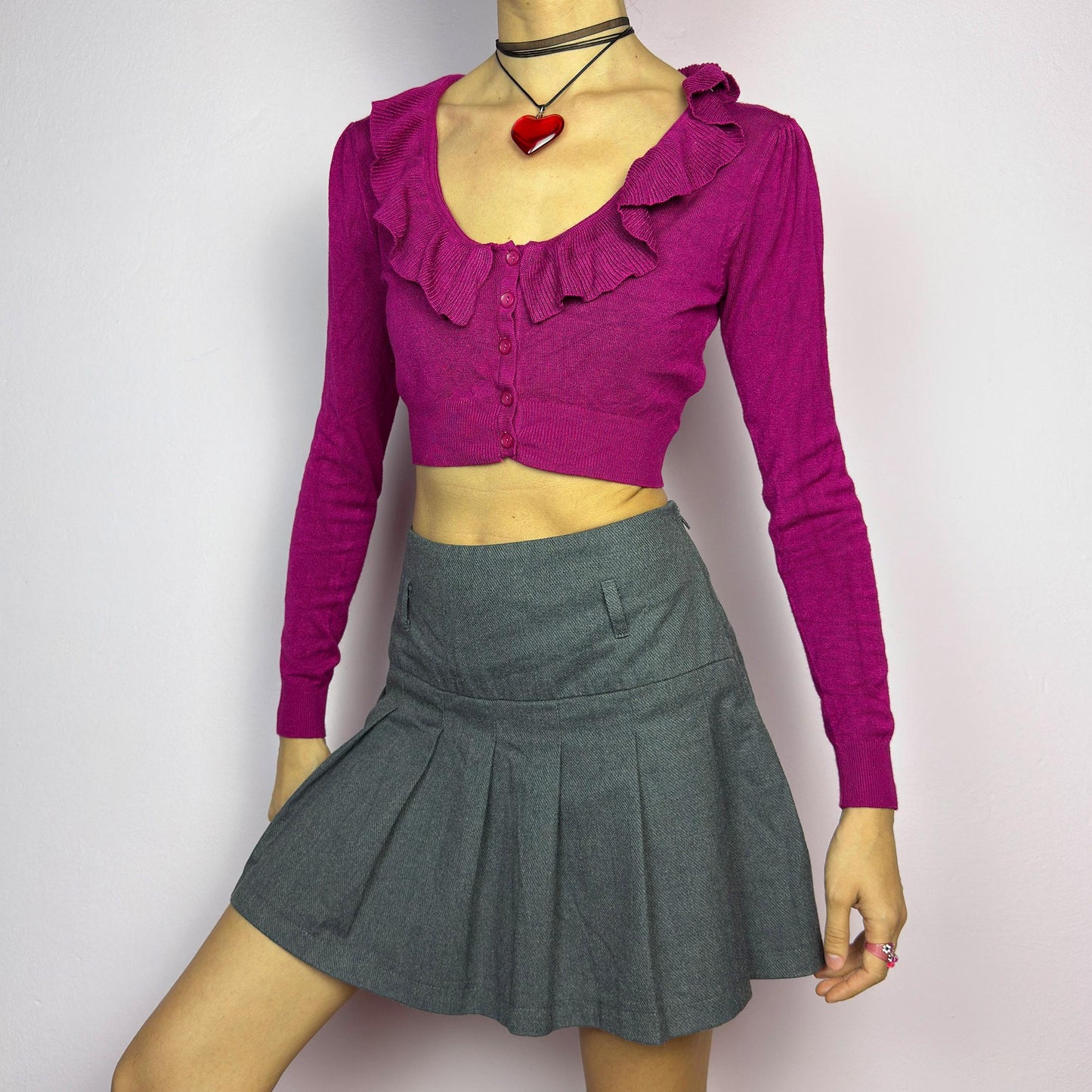 The Y2K Gray Pleated Mini Skirt is a vintage 2000s essential, featuring a structured pleated design and a side zipper closure. Made from a thick woven fabric, is perfect for preppy, grunge, or casual outfits. adult world shop